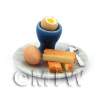 Dolls House Miniature Boiled Egg With the Top off in a Blue Egg Cup
