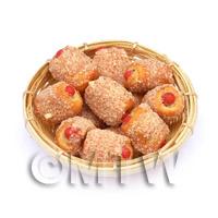 12 Miniature Cheese Coated Sausage Rolls In A Large Basket