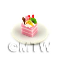Miniature  Pink And White Square Cake Slice Topped With Fruit