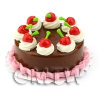 Miniature Round Cherry Topped Chocolate Cake