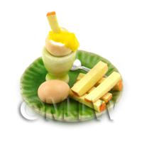 Dolls House Miniature Boiled Egg Being Dipped On A Green Plate 