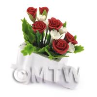 Mixed Red and White Flowers in a Miniature Wheelbarrow Planter