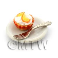 Miniature Orange Cream Cupcake In An Orange Paper Cup On A Plate With A Fork