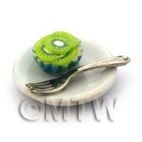 Miniature Kiwi Cream Cupcake In A Blue Paper Cup On A Plate With A Fork