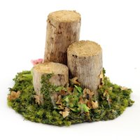 A Handmade Spring Garden Scene With Bark-less Tree Stumps