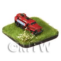 a red painted Petrol/Gas Tanker on grass