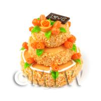 Orange Iced Miniature 3 Tier Celebration Cake topped with Fondant Flowers