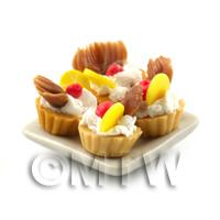 4 Dolls House Lemon Tart with A Chocolate Fan on a Plate With a Spoon